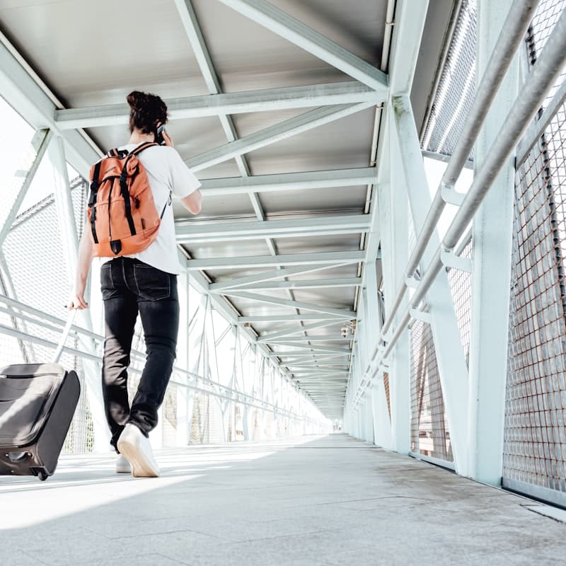 Traveller with luggage at airport